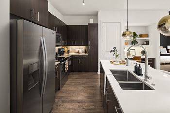 a kitchen with stainless steel appliances and a sink